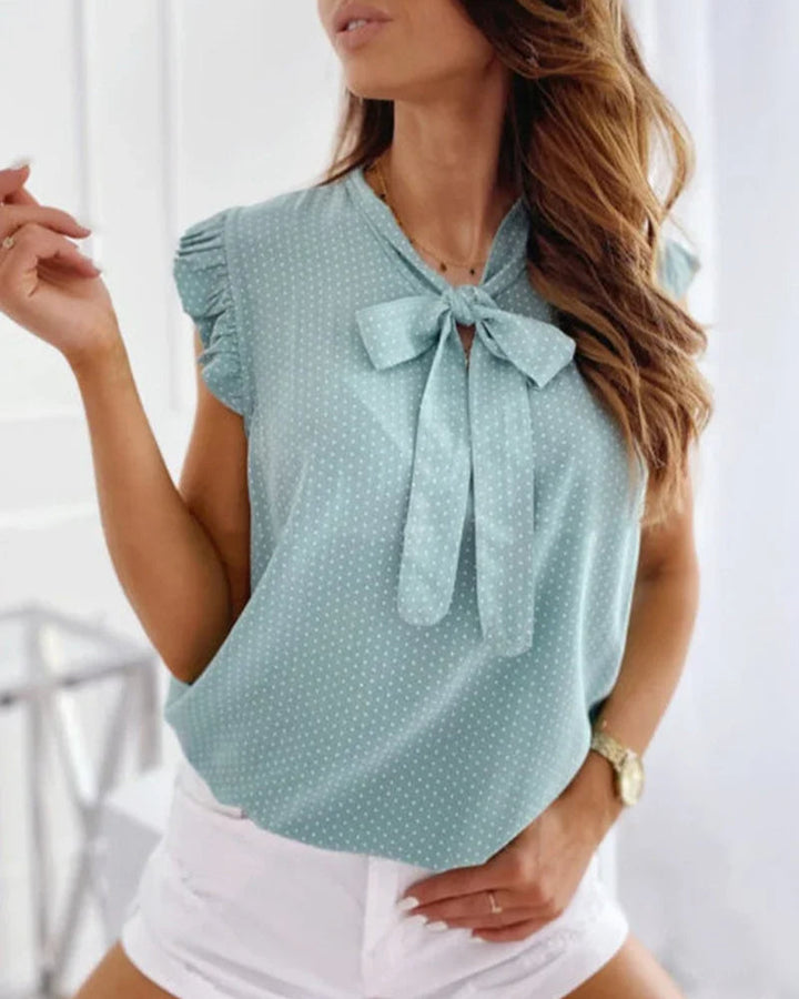 Sleeveless Blouse with Ruffles and Bow Detail
