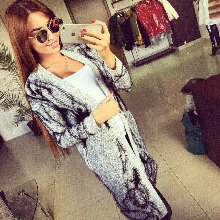 Women's knit dress with artistic graphic design and an elegant V-neck Chic and Style