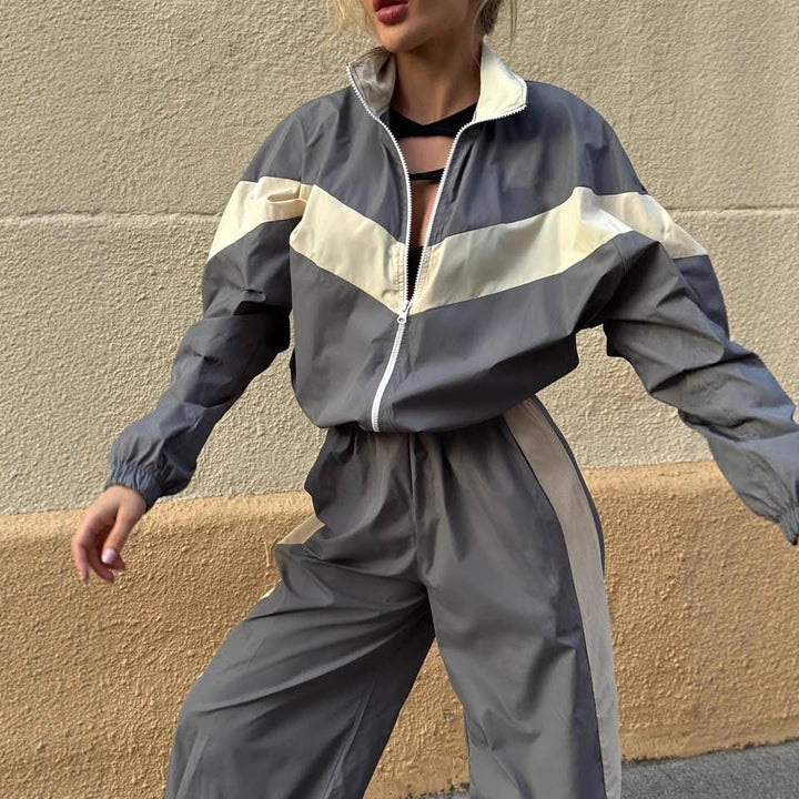 Women's sporty windbreaker with high collar and contrasting stripes Chic & Stil
