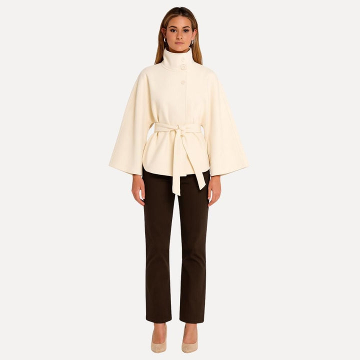 https://cdn.shopify.com/s/files/1/0876/2487/6380/files/kouvr-jannah-white-wool-cape-jacket-front.jpg?v=1772395323