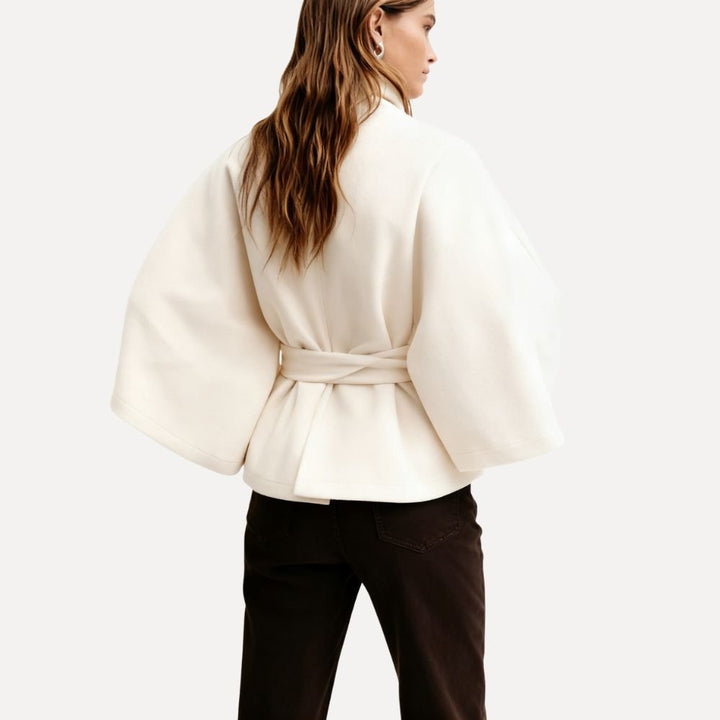 https://cdn.shopify.com/s/files/1/0876/2487/6380/files/kouvr-jannah-white-wool-cape-jacket-front1.jpg?v=1772395323
