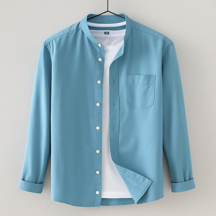 https://cdn.shopify.com/s/files/1/0876/2487/6380/files/light_blue_button_shirt.jpg?v=1775846338